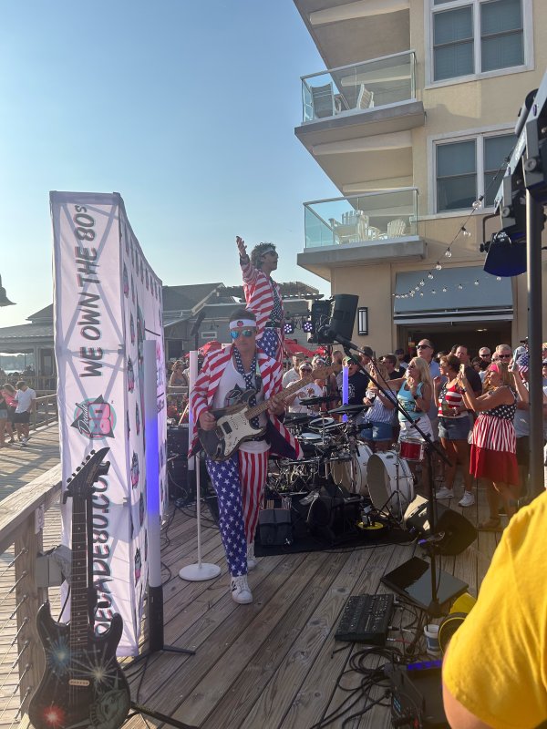Popular ‘80s cover band Decade 80 performs in America-themed outfits near the Lighthouse in Dewey. SUBMITTED PHOTO